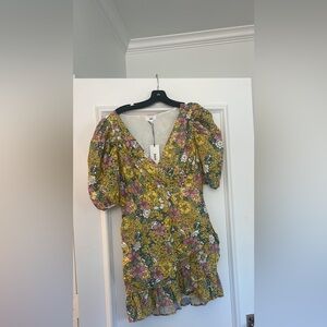 RAHI dress flower pattern with puff sleeves. Sells at Anthropologie.